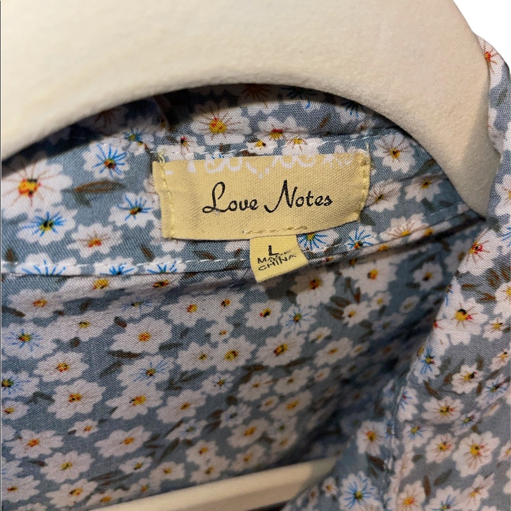 Blue and Yellow floral print button down shirt.